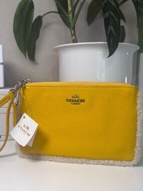 NWT COACH Yellow Pebbled Leather Wristlet with Shearling Trim
